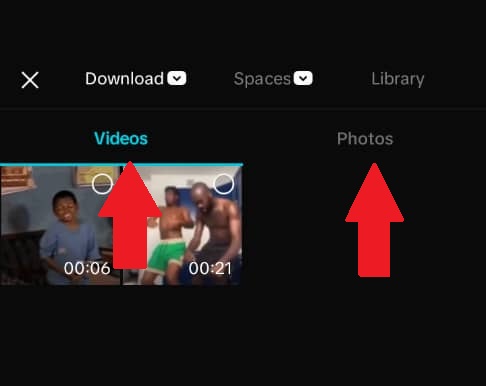 CapCut media import screen showing the "Videos" tab selected with two video thumbnails visible, and the "Photos" tab available to toggle between video and photo selection when adding clips to a project.