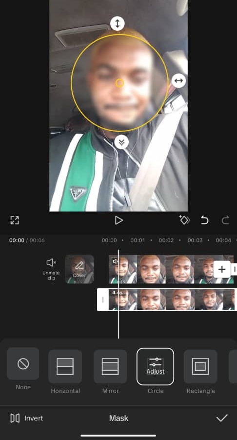 CapCut mobile app showing the Mask panel with a circular mask (highlighted in yellow) applied and repositioned over a person's face in the video preview, with mask shape options — None, Horizontal, Mirror, Circle, and Rectangle — visible at the bottom of the screen.